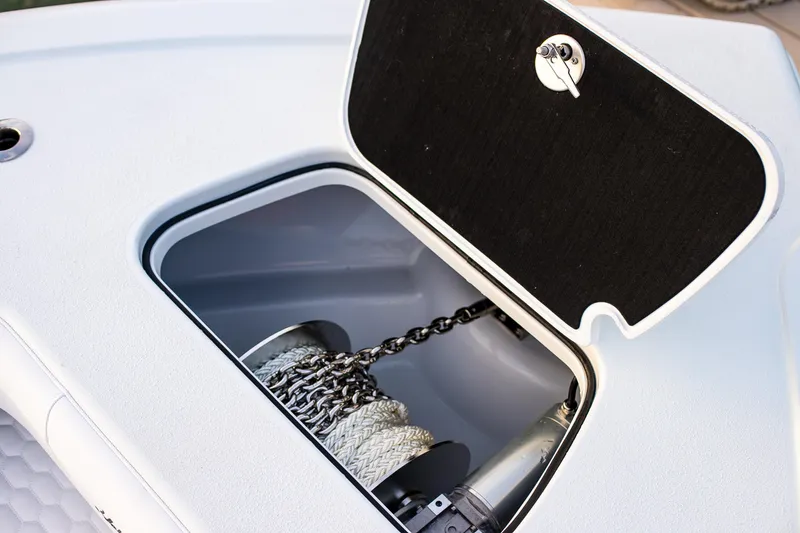 Slide: The Image of 2026 Yellowfin 36 Offshore boat anchor storage compartment with chain and rope. - 136