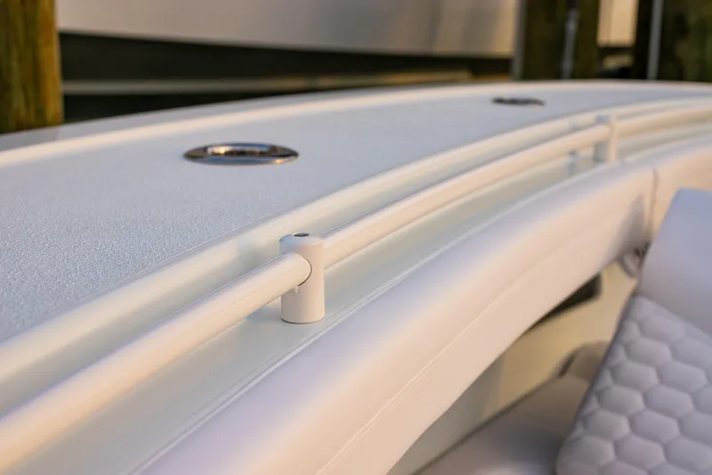 Slide: The Image of Close-up of 2026 Yellowfin 36 Offshore boat's sleek white railing and textured deck. - 138