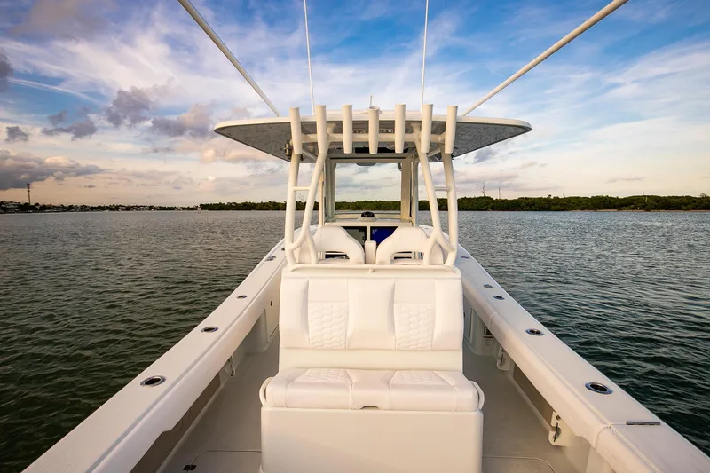 Slide: The Image of 2026 Yellowfin 36 Offshore boat on calm water under a blue sky. - 14