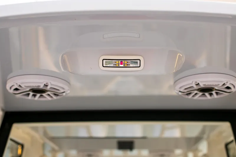 Slide: The Image of 2026 Yellowfin 36 Offshore boat interior with speakers and LED light. - 141