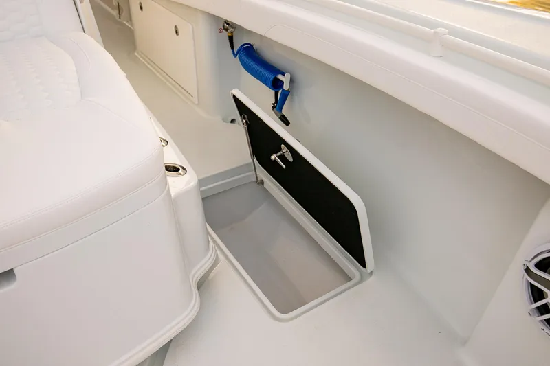 Slide: The Image of 2026 Yellowfin 36 Offshore boat interior with storage compartment and seating. - 146