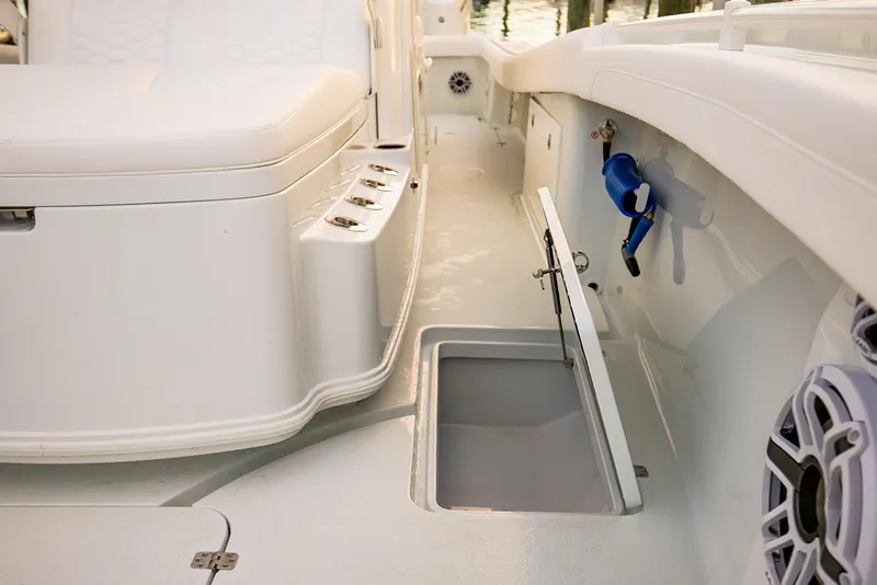 Slide: The Image of 2026 Yellowfin 36 Offshore boat interior with open storage compartment and seating. - 147