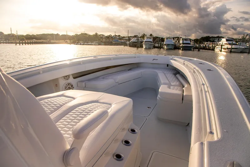 Slide: The Image of 2026 Yellowfin 36 Offshore boat interior at sunset, docked in marina. - 150