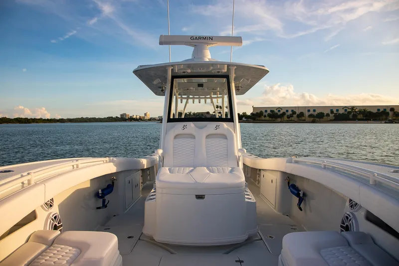Slide: The Image of 2026 Yellowfin 36 Offshore boat interior on calm water at sunset. - 151