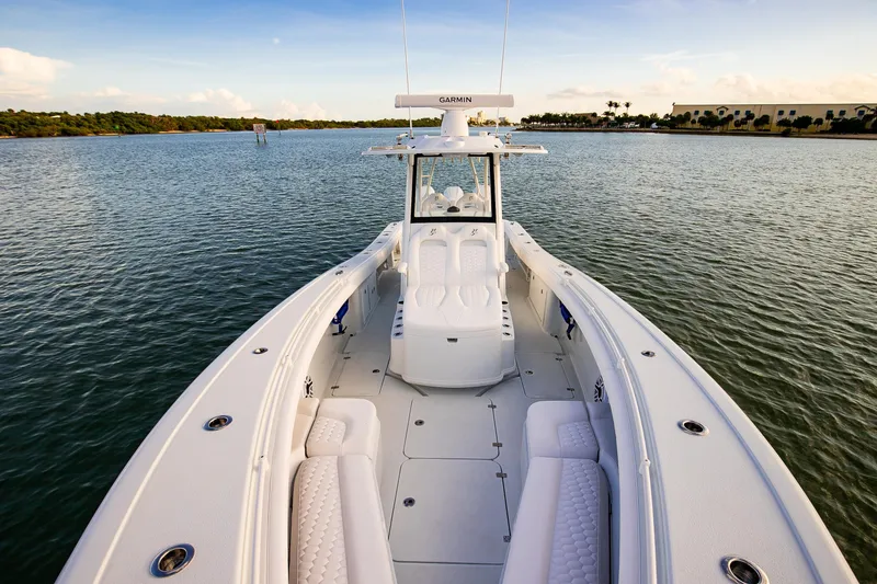 Slide: The Image of 2026 Yellowfin 36 Offshore boat on calm water, showcasing spacious deck and seating. - 155