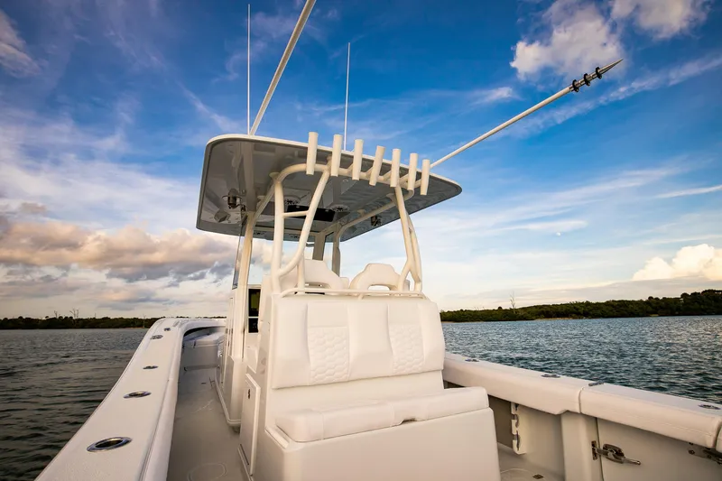 Slide: The Image of 2026 Yellowfin 36 Offshore boat on calm water under a blue sky. - 16