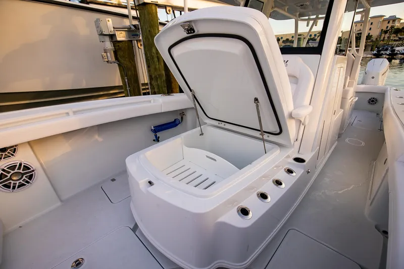 Slide: The Image of 2026 Yellowfin 36 Offshore boat interior with open storage compartment. - 163
