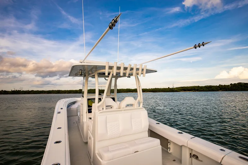 Slide: The Image of 2026 Yellowfin 36 Offshore boat on calm water under a blue sky. - 17