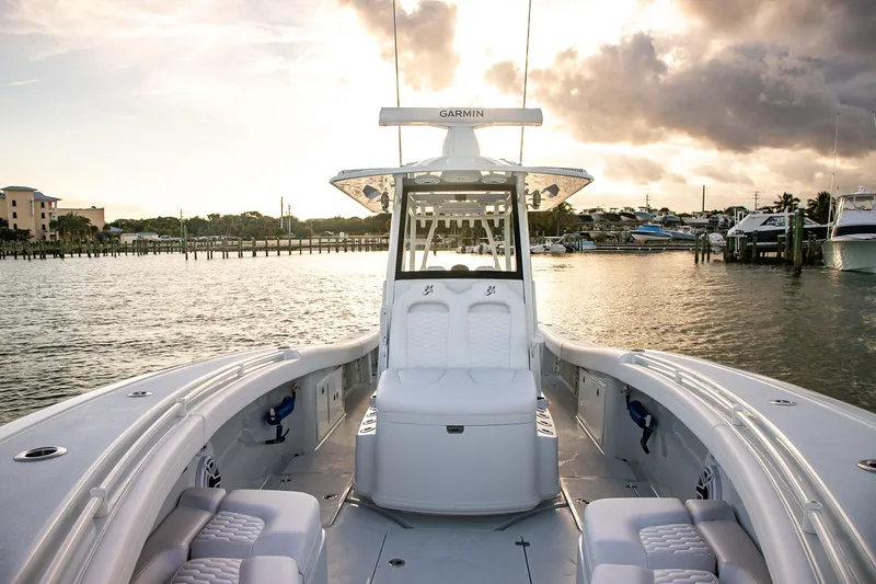 Slide: The Image of 2026 Yellowfin 36 Offshore boat on calm water at sunset, featuring spacious seating. - 175