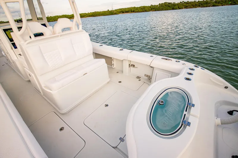 Slide: The Image of 2026 Yellowfin 36 Offshore boat interior with white seating and fishing amenities. - 18
