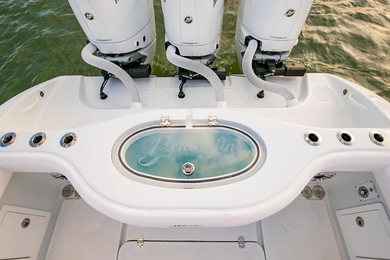 Slide: The Image of 2026 Yellowfin 36 Offshore boat with triple engines and livewell on deck. - 23