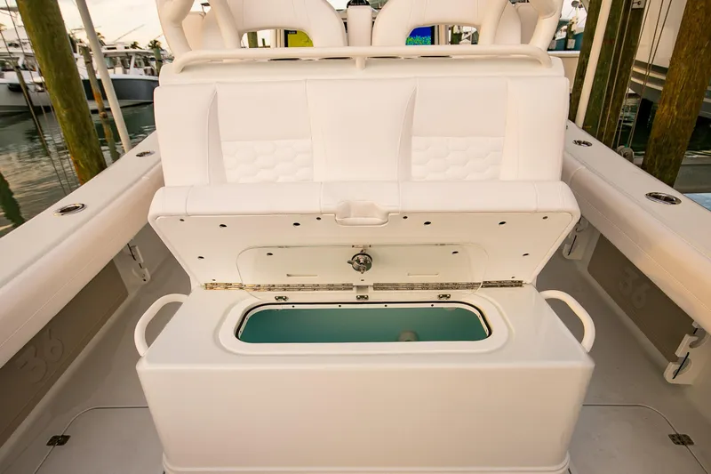 Slide: The Image of 2026 Yellowfin 36 Offshore boat with open storage compartment, white seating. - 26