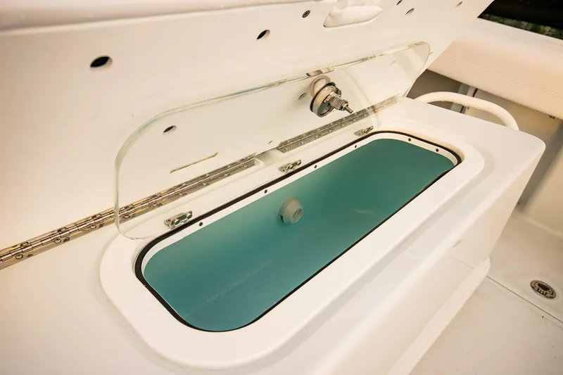 Slide: The Image of Livewell on 2026 Yellowfin 36 Offshore boat, open lid, white interior. - 27