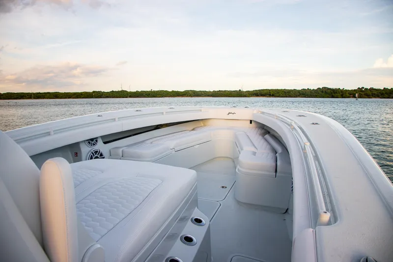 Slide: The Image of 2026 Yellowfin 36 Offshore boat interior with luxurious seating on calm water. - 30