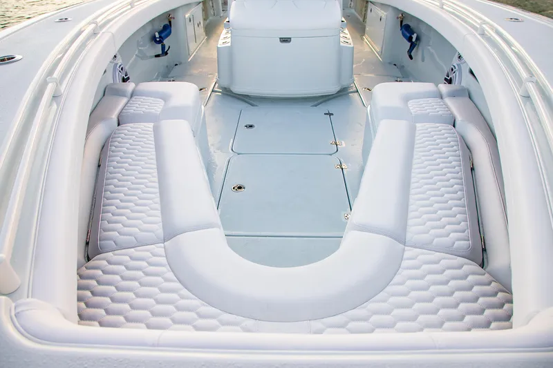 Slide: The Image of 2026 Yellowfin 36 Offshore boat interior with luxurious white seating and spacious deck. - 33