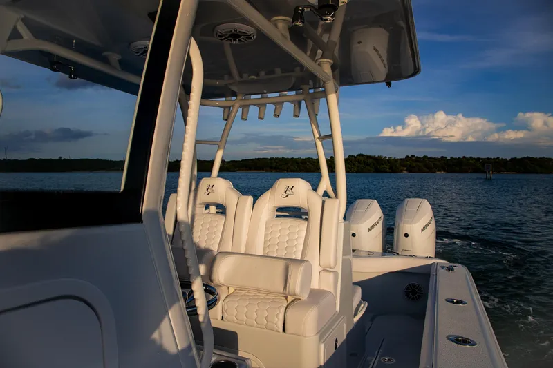 Slide: The Image of 2026 Yellowfin 36 Offshore boat with luxurious seating and powerful engines on a serene water backdrop. - 37