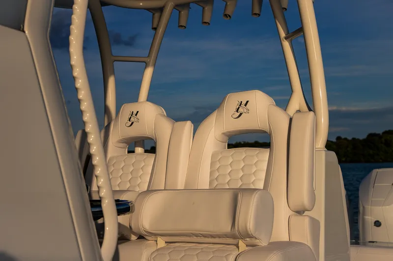 Slide: The Image of 2026 Yellowfin 36 Offshore boat with luxurious white seating and rod holders. - 39