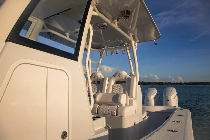 Slide: The Image of 2026 Yellowfin 36 Offshore boat with sleek design and powerful engines on calm water. - 40