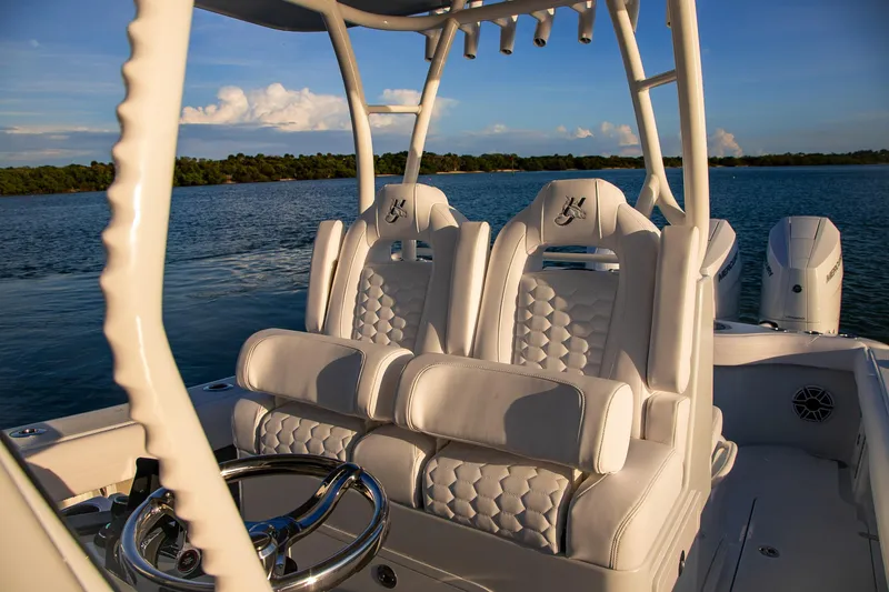 Slide: The Image of 2026 Yellowfin 36 Offshore boat interior with luxurious seating and steering wheel. - 41