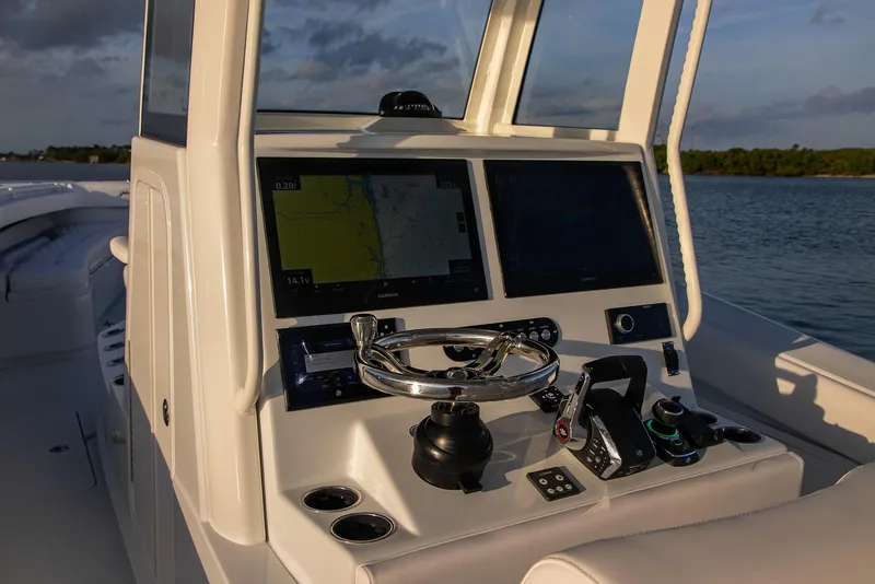 Slide: The Image of 2026 Yellowfin 36 Offshore boat dashboard with advanced navigation system. - 46