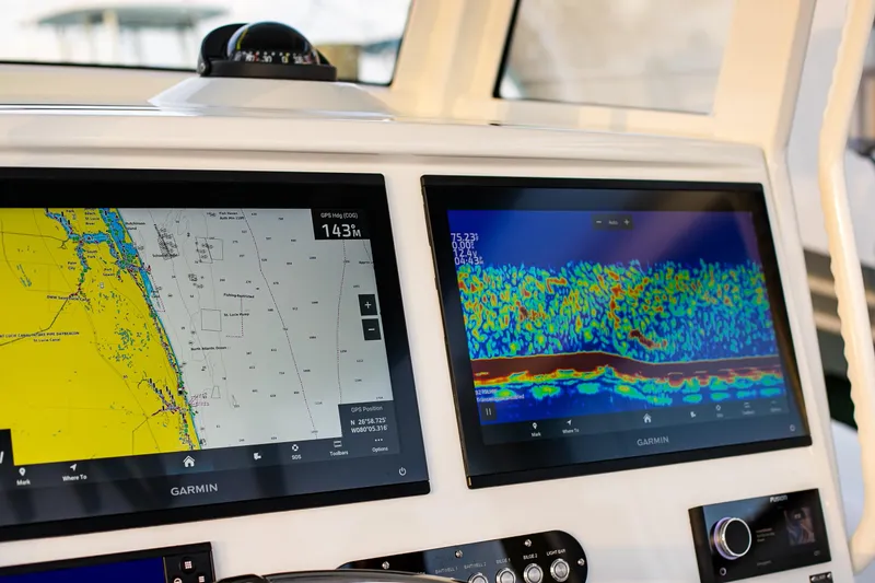 Slide: The Image of 2026 Yellowfin 36 Offshore boat with Garmin navigation and sonar displays. - 63