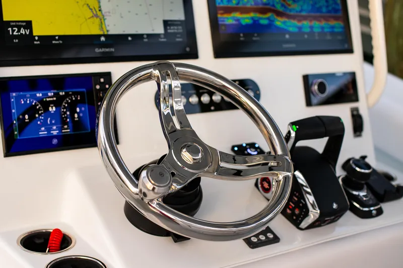 Slide: The Image of Steering console of 2026 Yellowfin 36 Offshore boat with advanced navigation displays. - 64
