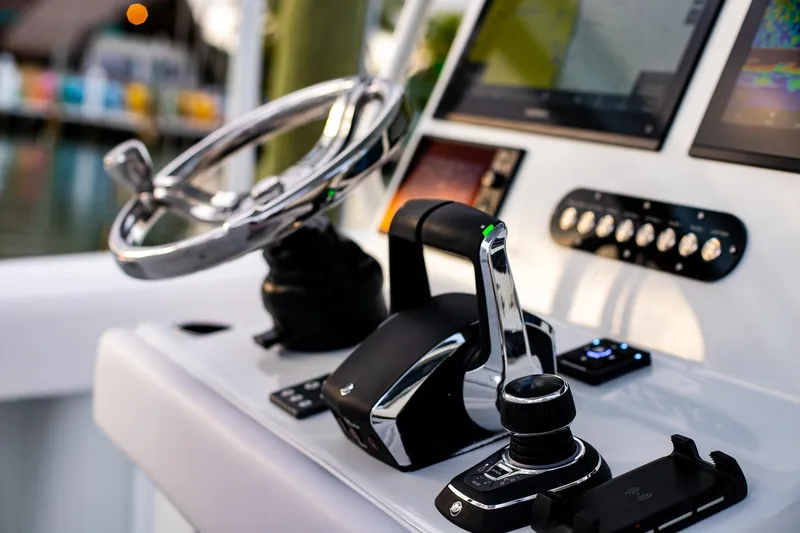 Slide: The Image of 2026 Yellowfin 36 Offshore boat helm with advanced controls and navigation displays. - 69