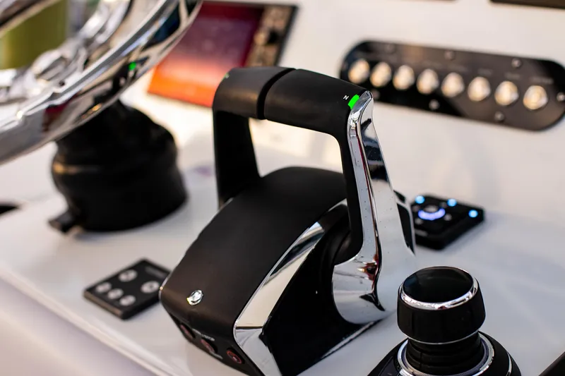 Slide: The Image of Control panel of 2026 Yellowfin 36 Offshore boat, featuring modern throttle and navigation controls. - 72