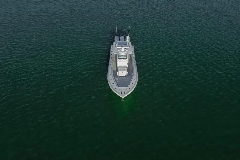 Slide: The Image of Aerial view of 2026 Yellowfin 36 Offshore boat on calm water. - 81