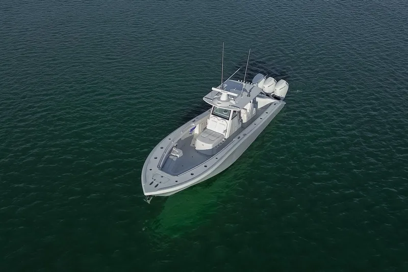 Slide: The Image of 2026 Yellowfin 36 Offshore boat cruising on calm, green waters. - 82
