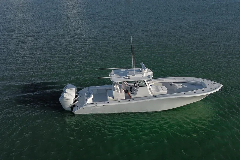 Slide: The Image of 2026 Yellowfin 36 Offshore boat cruising on calm green waters. - 83