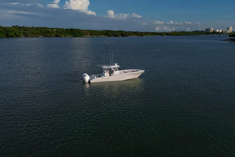 Slide: The Image of 2026 Yellowfin 36 Offshore boat on calm water under a clear sky. - 88