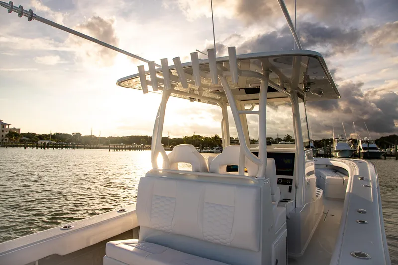 Slide: The Image of 2026 Yellowfin 36 Offshore boat at sunset on calm waters. - 9