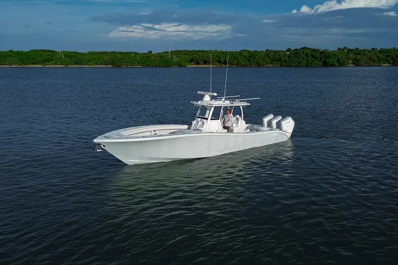 Slide: The Image of 2026 Yellowfin 36 Offshore boat cruising on calm waters under a clear sky. - 92
