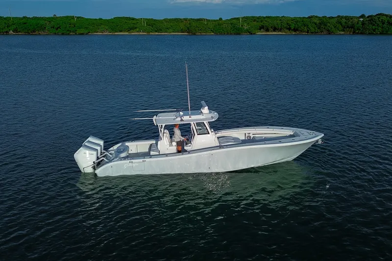 Slide: The Image of 2026 Yellowfin 36 Offshore boat on calm water, side view. - 97