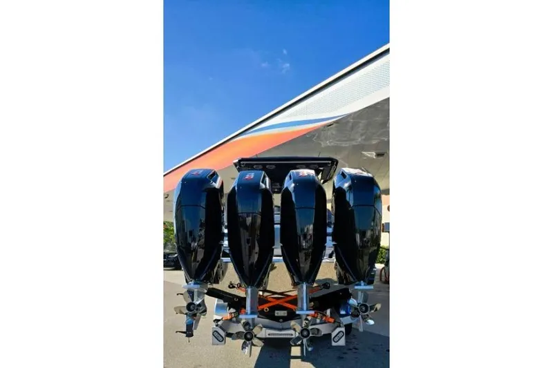 Slide: The Image of 2025 Nor-Tech 400 Supersport with four powerful outboard engines, under a clear blue sky. - 5