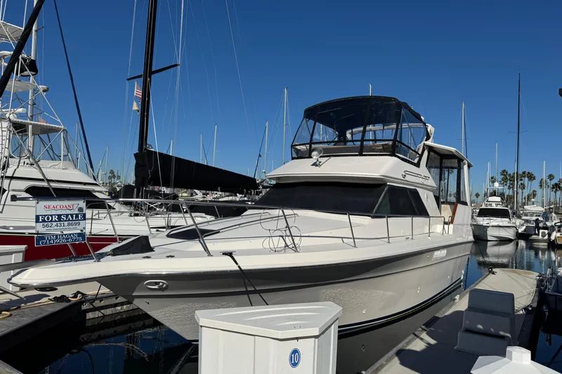 The Image of 1990 Sea Ray 380 Aft Cabin yacht docked, for sale at marina. - 0