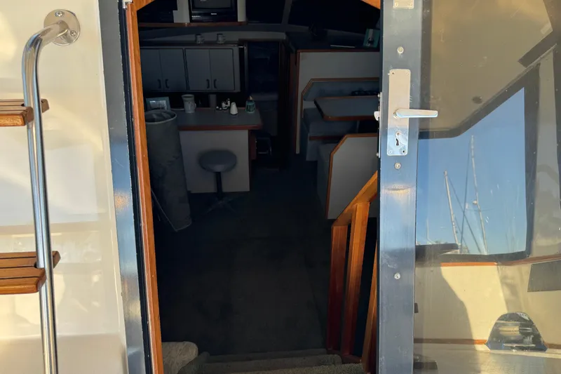 Slide: The Image of Interior view of 1990 Sea Ray 380 Aft Cabin yacht, showing stairs and cabin entrance. - 20