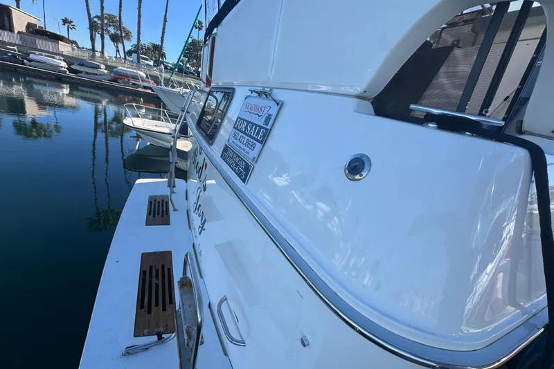 Slide: The Image of 1990 Sea Ray 380 Aft Cabin yacht for sale, docked in marina. - 4