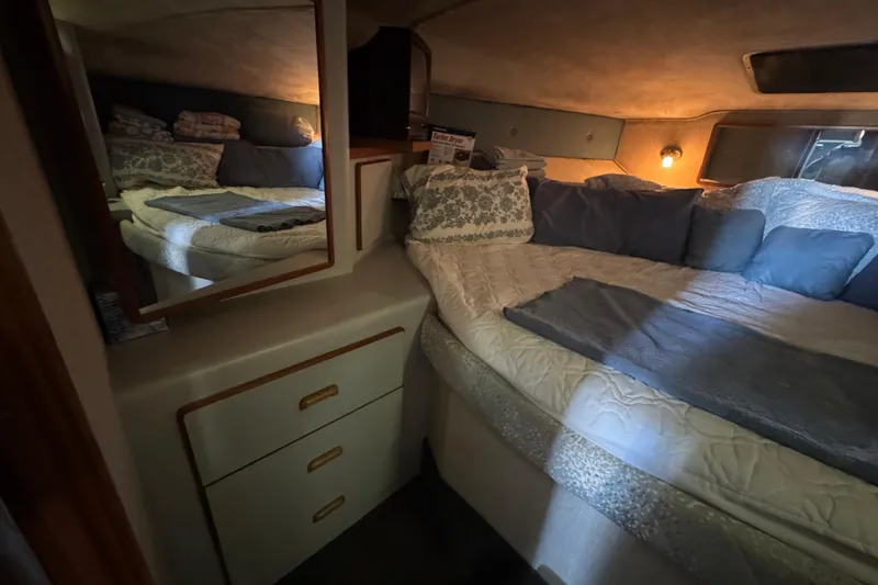 Slide: The Image of Cozy bedroom in 1990 Sea Ray 380 Aft Cabin yacht with mirror and soft lighting. - 40