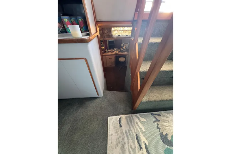 Slide: The Image of Interior of 1990 Sea Ray 380 Aft Cabin with stairs and cozy decor. - 46