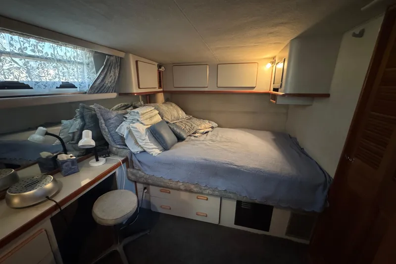 Slide: The Image of Interior of 1990 Sea Ray 380 Aft Cabin, cozy bedroom setting. - 49