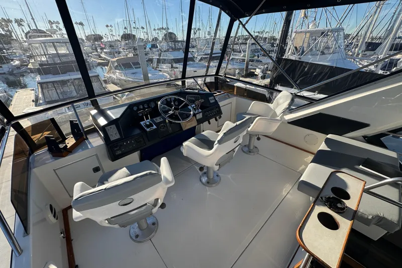 Slide: The Image of Cockpit of 1990 Sea Ray 380 Aft Cabin yacht with marina view. - 60