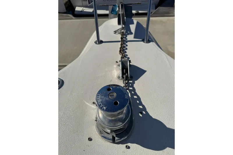 Slide: The Image of 1990 Sea Ray 380 Aft Cabin boat deck with anchor chain and winch. - 66