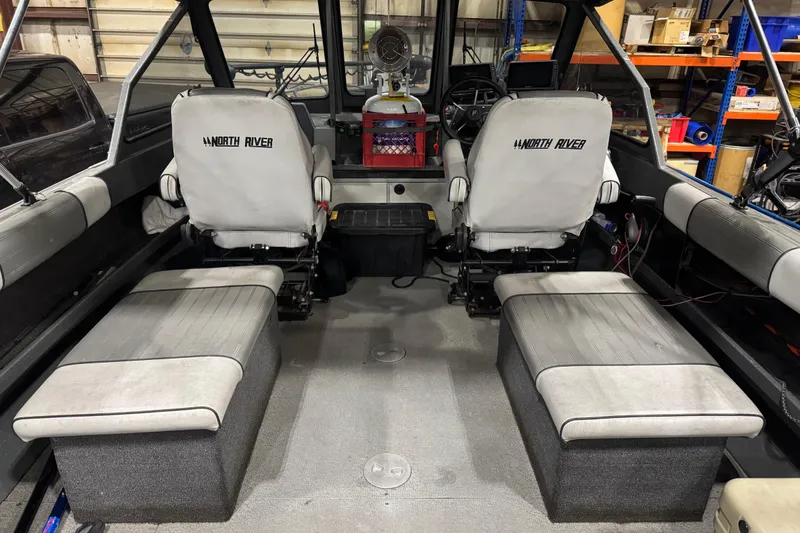 Slide: The Image of 2008 North River 21 SEAHAWK boat interior with seating and steering wheel. - 19