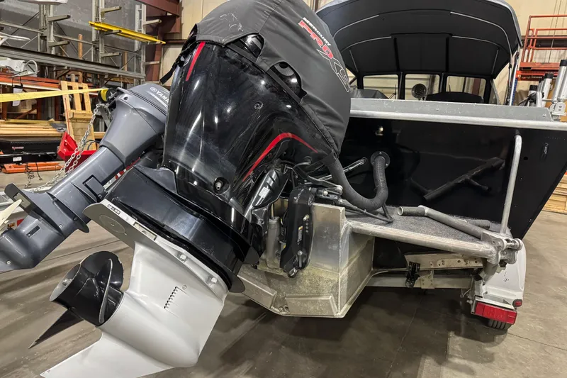 Slide: The Image of 2008 North River 21 SEAHAWK boat with Yamaha outboard motor in a workshop setting. - 4