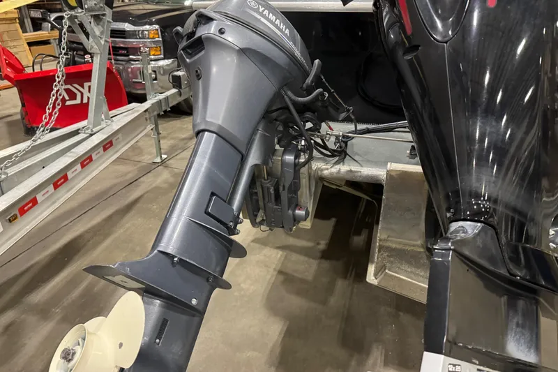 Slide: The Image of 2008 North River 21 SEAHAWK with Yamaha outboard motor in a garage setting. - 6