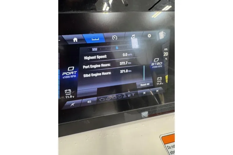 Slide: The Image of Yamaha Boats 2021 255 FSH Sport E dashboard display showing engine hours and speed metrics. - 10