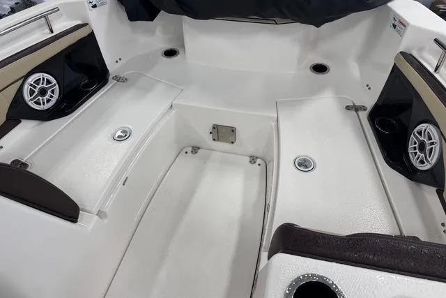 Slide: The Image of 2021 Yamaha Boats 255 FSH Sport E interior with seating and speakers. - 11