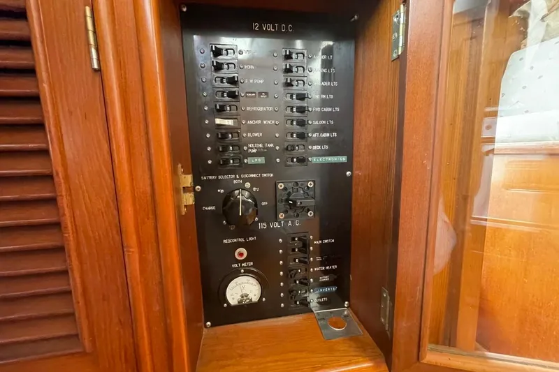 Slide: The Image of Electrical panel of 1991 Marine Trader 34 Double Cabin boat, featuring 12V and 115V systems. - 10